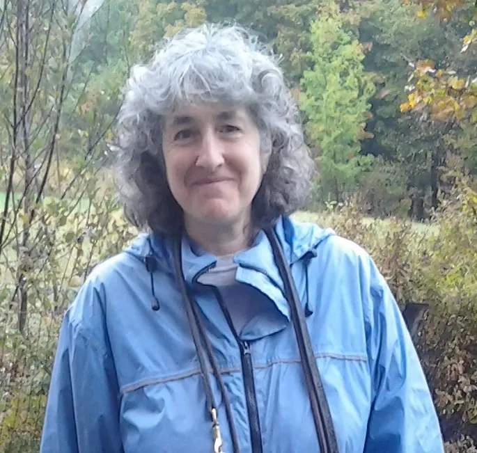 Miranda outdoors in a blue jacket